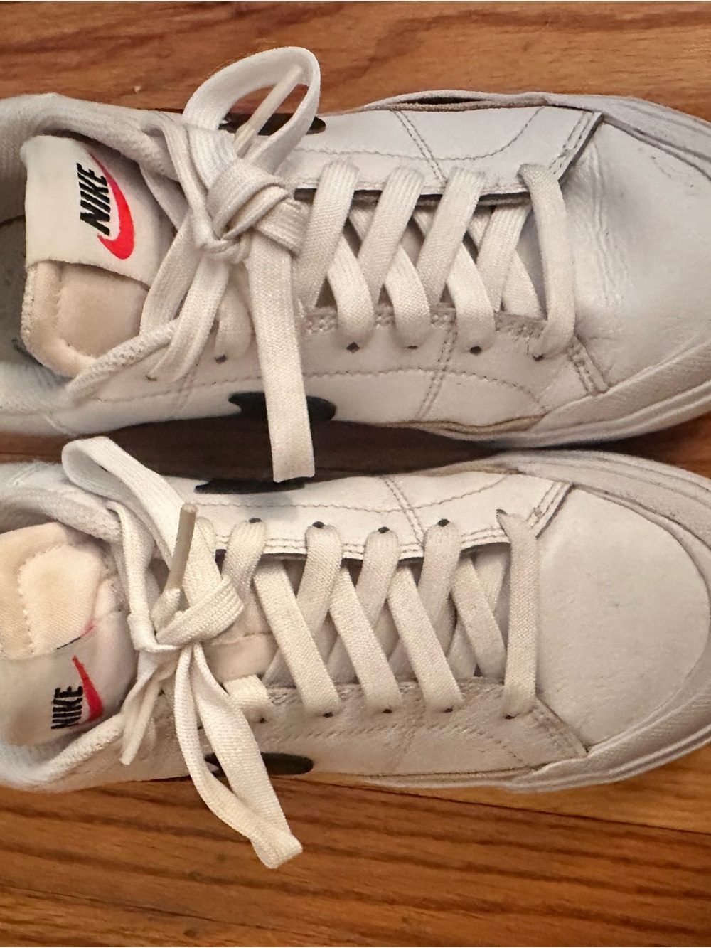 Nike White Low-Top Sneakers with Black Swoosh